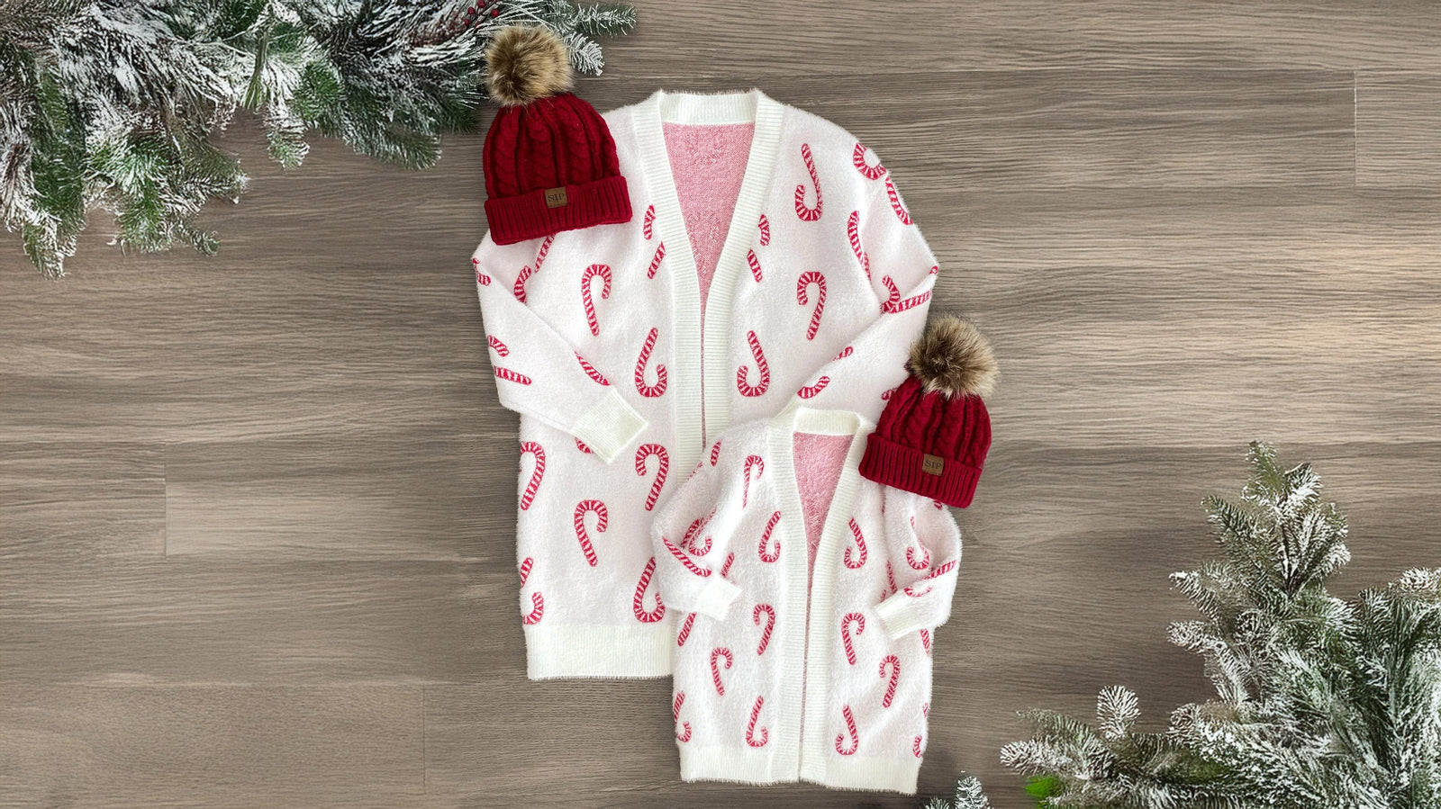 Matching mom and child cardigans in a white design with a festive candy cane print. These Cozy Candy Cane Cardigans feature long sleeves and ultra-soft material, perfect for all-season wear. The cozy, versatile style keeps her comfortable for any adventure, and pairs beautifully with various bottoms and booties for a coordinated holiday look that little ones will love to match with mom.