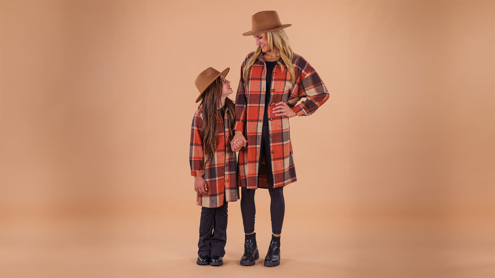 A cozy matching vest set for mom and child, featuring a rust vest and stripe long sleeve top made from ultra-soft, stretchy fabric. Perfect for layering in fall and winter, this set offers comfort and style for all adventures.